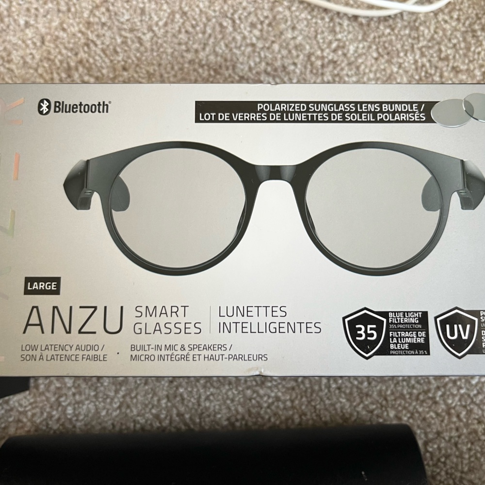 Razed smart glasses, it has extra lenses. Sun glasses black tanned.